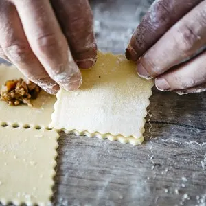 Making ravioli on a wooden table and tools