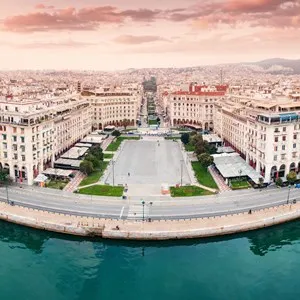 Aerial view of main tourist attraction of Thessaloniki - Aristotle Square with cafes and hotel buildings.