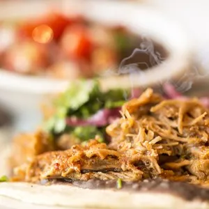 Taco: typical Mexican food: Mexican food, taco Mexican meal Mexican with meat, beef, salsa dipping sauce and salad close up.