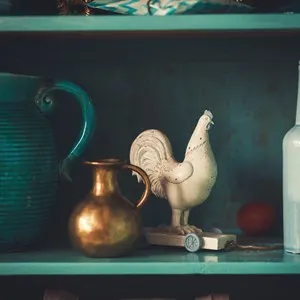 Vintage pots and toys on a shelf in an antique shop