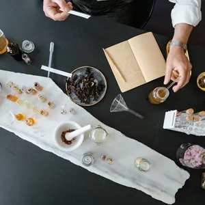 items on a table used for making perfume