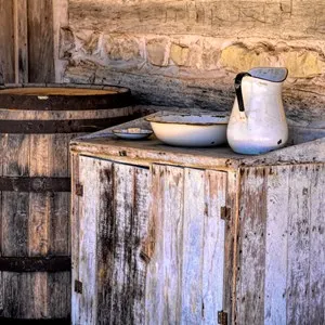 old wooden barrel with water basin