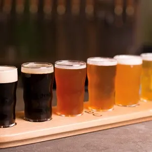 Close up of craft beer tasting flight at local brewery of small pint glasses
