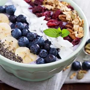 Breakfast smoothie bowl with fruits and granola