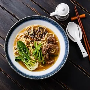Ramen asian noodle in broth with Beef and Oyster mushrooms