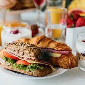 Healthy breakfast served with coffee, frouts and sandwiches and muesli