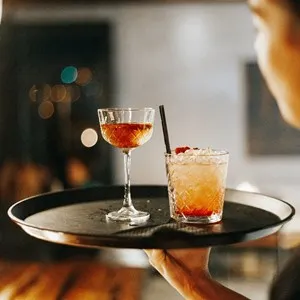 two cocktails on a tray