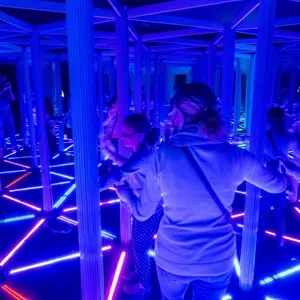 person in a mirror room