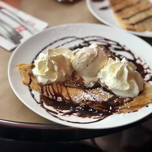 crepes with chocolate and whipped cream