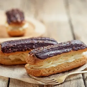Traditional french eclairs with chocolate. - Picture